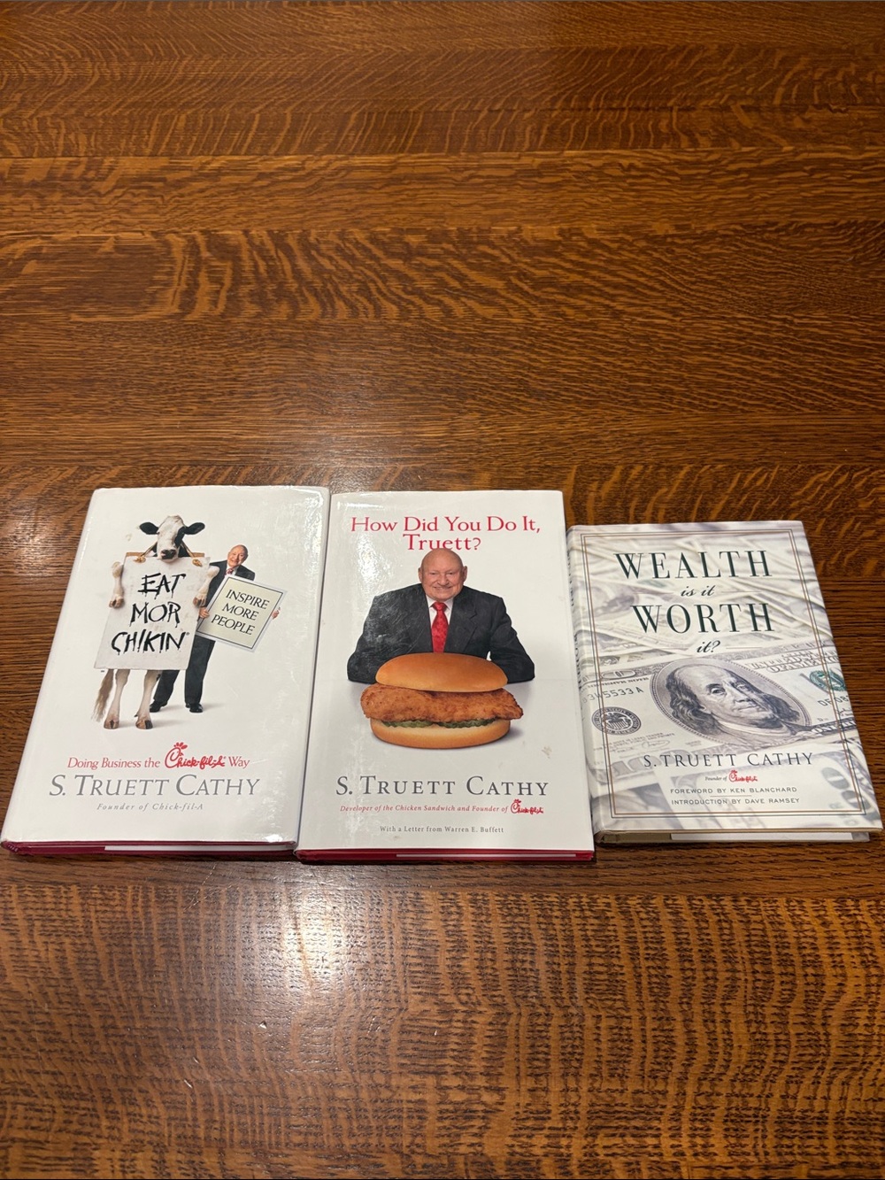Collection of 3 Chick-fil-a hardback books by S.  Truett Cathy
